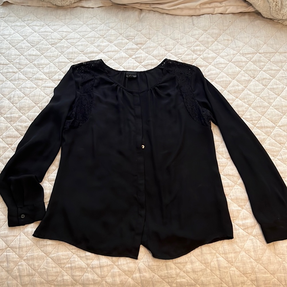 Sheer black top with with lace around shoulder area